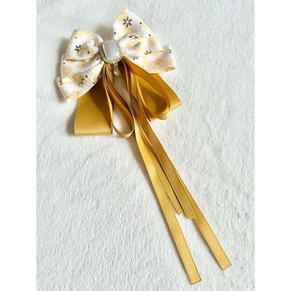 Adorable floral yellow hair bow with floral and pearl accents with hair Barrette